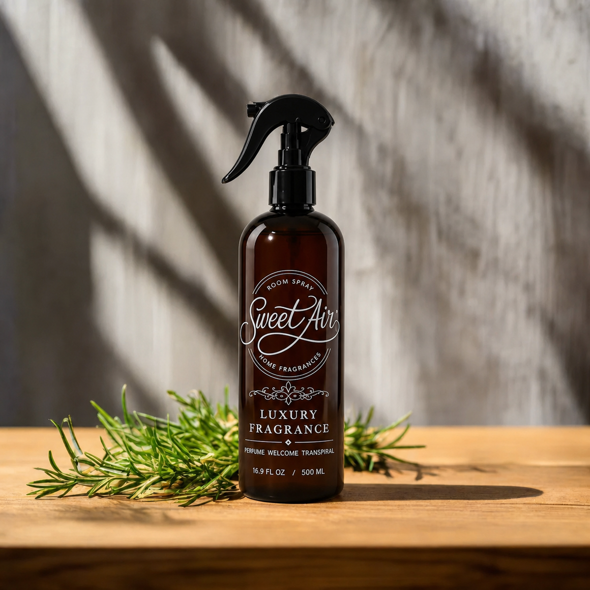 Filled Home Spray 16 oz / 500 ml bottle with rosemary on a light cream background